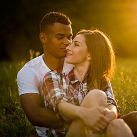 couple chilling together on long grass