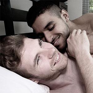 gay guys lying in bed