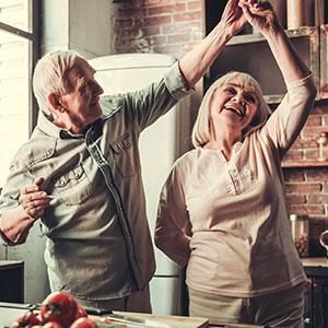 seniors dating, couple dancing in the kitchen.