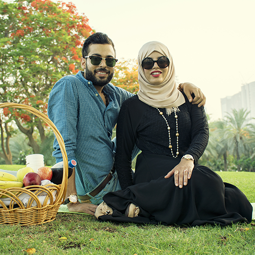 Muslim Couple On A Picnic. Smiling.