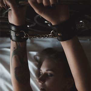Bondage action, handcuffs and blindfolds.